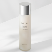 A bottle of Tirtir Milk Skin Toner with a capacity of 150ml. The bottle is white with a silver cap and the product name is printed on the front.