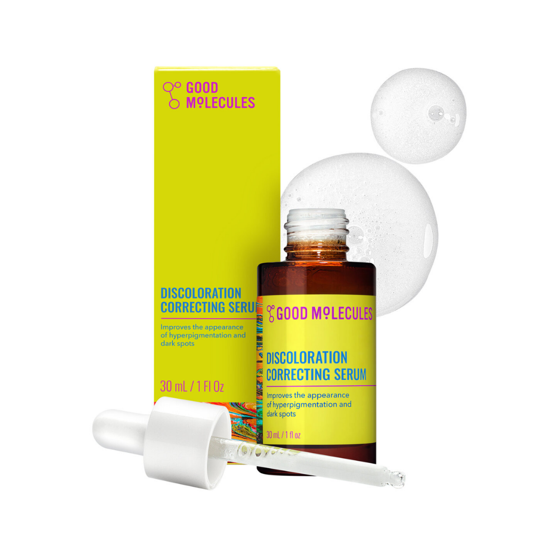 Good Molecules Discoloration Correcting Serum bottle with a bright yellow label, shown with its matching lime-yellow box, white dropper, and two white droplets on a clean white background.